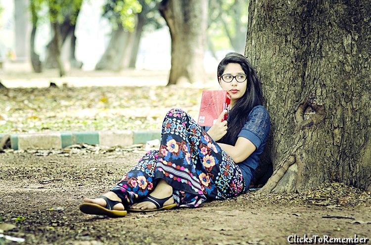 Photo of a model reading a book Outdoor Model Photography in Bangalore
