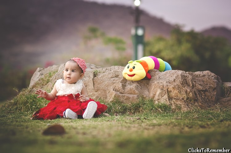 Image of a baby with its toys Kids Photography in Udaipur